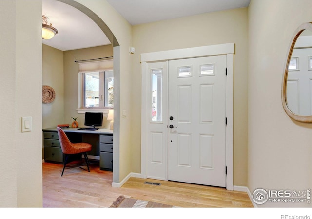 foyer with light hardwood / wood-style floors