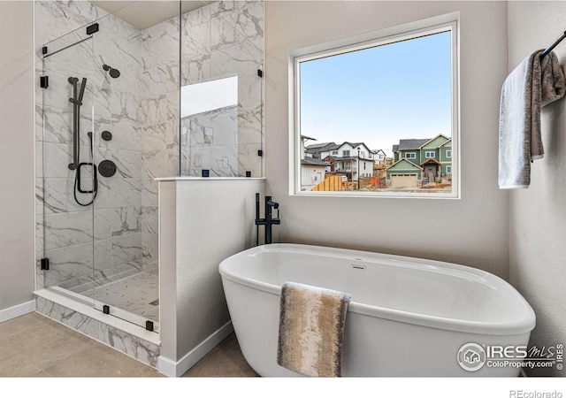 bathroom featuring separate shower and tub