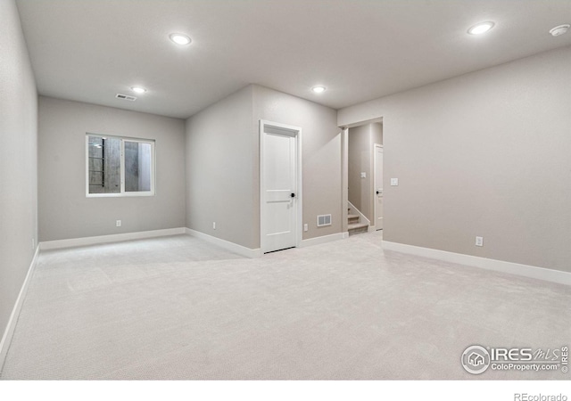 empty room featuring light colored carpet