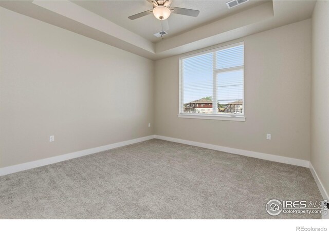 968 Birdwhistle Ln Unit 12, Fort Collins, CO 80524 - spare room with a raised ceiling, carpet flooring, baseboards, and a ceiling fan