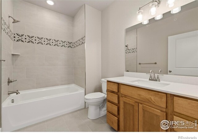 968 Birdwhistle Ln Unit 12, Fort Collins, CO 80524 - full bathroom with toilet,  shower combination, vanity, and tile patterned flooring