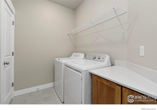 968 Birdwhistle Ln Unit 12, Fort Collins, CO 80524 - washroom with washing machine and dryer and baseboards