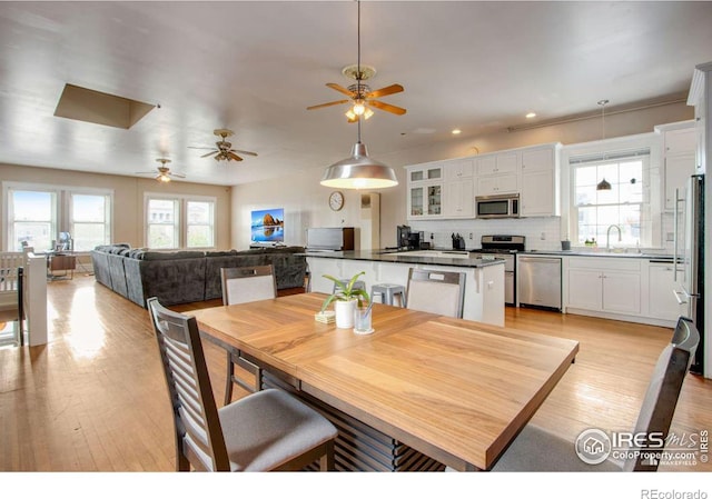 922 8th Ave, Greeley, CO 80631 - dining space with a ceiling fan, light wood-style flooring, and recessed lighting
