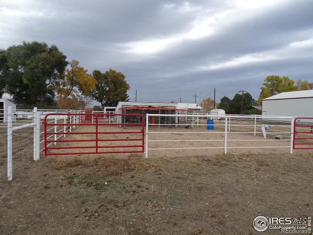 view of gate featuring a rural view