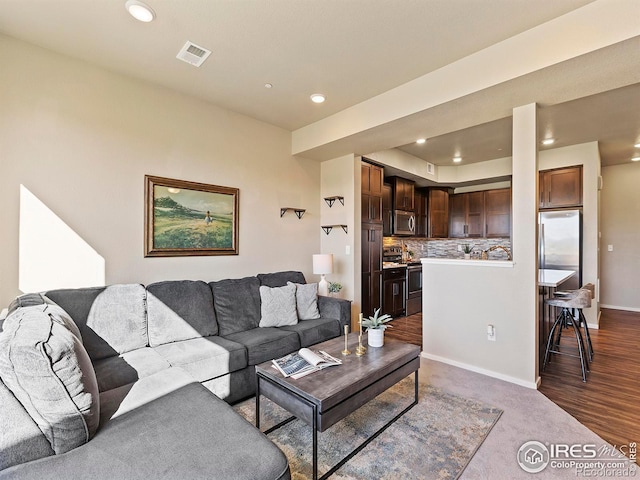 living room with dark hardwood / wood-style flooring