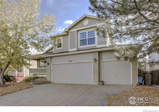 view of front property featuring a garage and covered porch