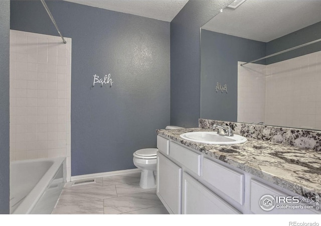 full bathroom with vanity, shower / bathing tub combination, a textured ceiling, and toilet