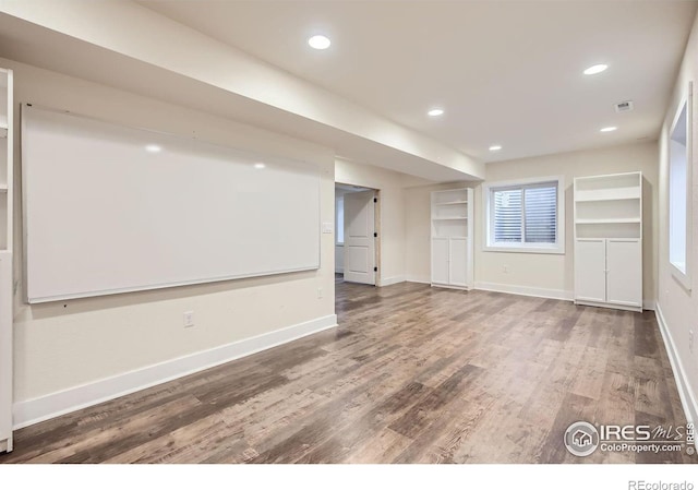 18715 Wagon Trl, Mead, CO 80542 - empty room with wood finished floors, baseboards, and recessed lighting