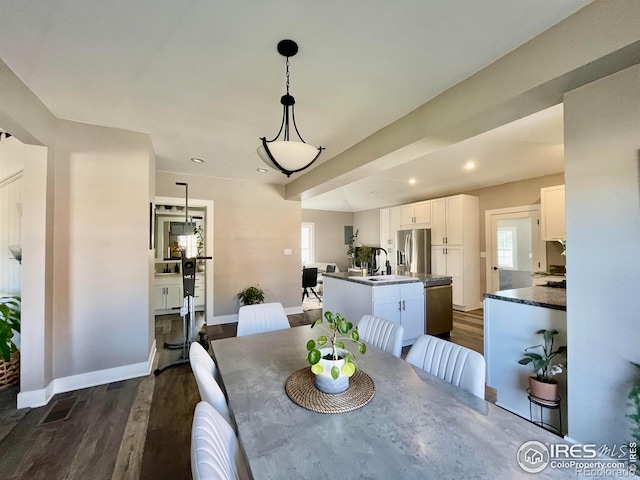 304 S High School Ave, Holyoke, CO 80734 - dining space featuring dark wood-type flooring and recessed lighting
