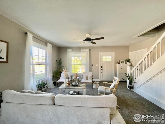 304 S High School Ave, Holyoke, CO 80734 - living area with carpet, healthy amount of natural light, stairs, and ceiling fan