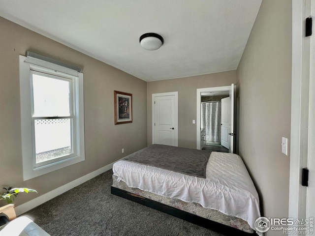 304 S High School Ave, Holyoke, CO 80734 - bedroom featuring multiple windows and carpet flooring