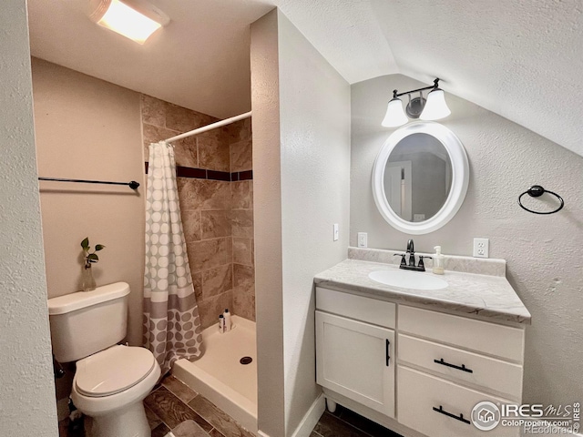 304 S High School Ave, Holyoke, CO 80734 - bathroom featuring vanity, tiled shower, vaulted ceiling, a textured wall, and a textured ceiling