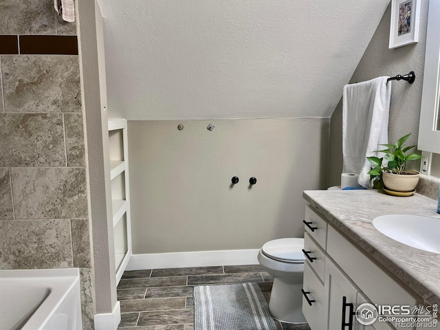 304 S High School Ave, Holyoke, CO 80734 - bathroom featuring vanity, a tub, vaulted ceiling, a textured ceiling, and a shower