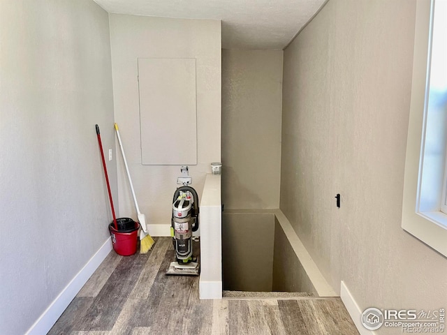 304 S High School Ave, Holyoke, CO 80734 - staircase with wood finished floors and a textured wall