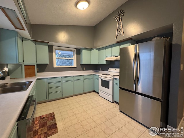 kitchen featuring sink, stainless steel fridge, dishwashing machine, green cabinets, and electric stove