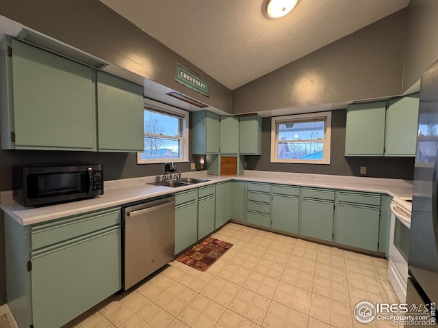 kitchen featuring dishwasher, sink, white electric range oven, a textured ceiling, and vaulted ceiling