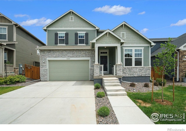 craftsman-style home with a porch and a garage