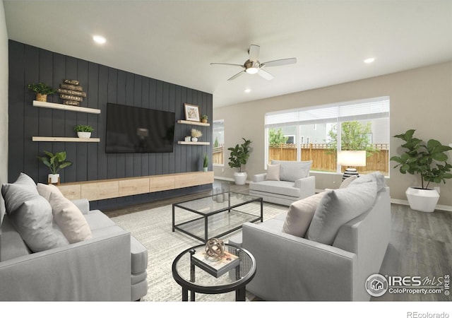 living room with ceiling fan and hardwood / wood-style floors