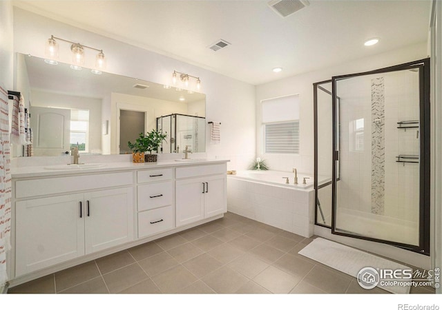 bathroom with vanity, tile patterned floors, and separate shower and tub