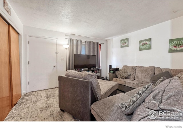 living room featuring visible vents and a textured ceiling