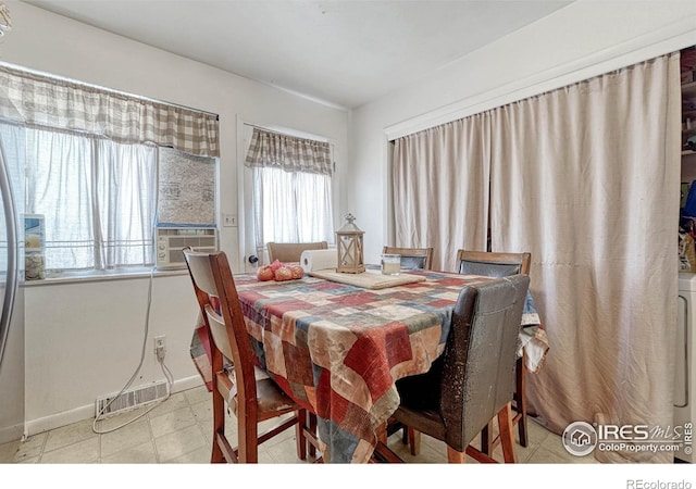 dining area featuring cooling unit, visible vents, and baseboards