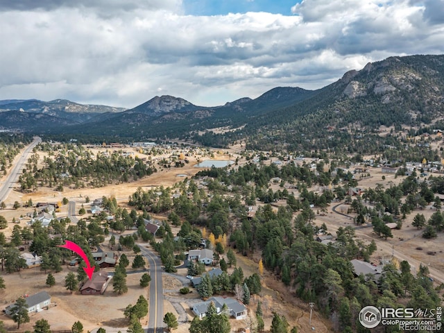 birds eye view of property featuring a mountain view