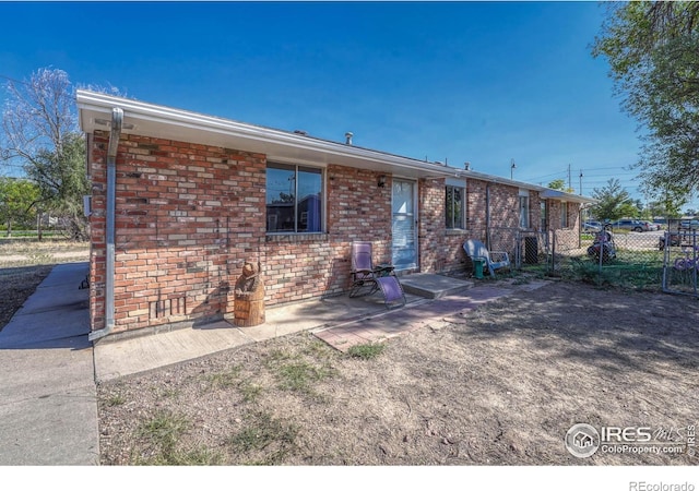 rear view of house featuring a patio