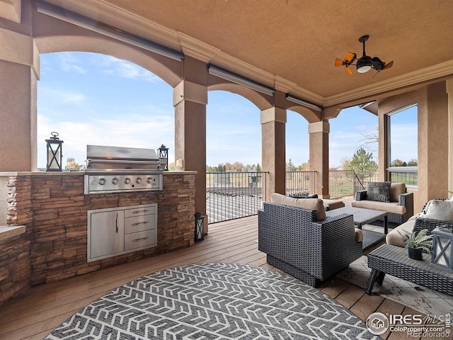 view of patio / terrace with ceiling fan, area for grilling, outdoor lounge area, a deck, and a grill