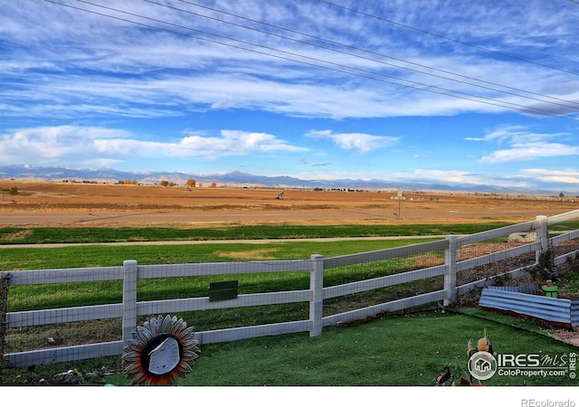 view of yard featuring a mountain view and a rural view