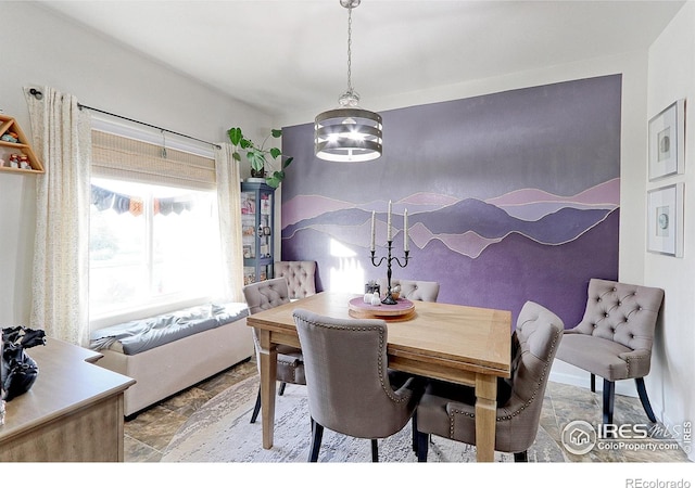 dining area featuring an inviting chandelier