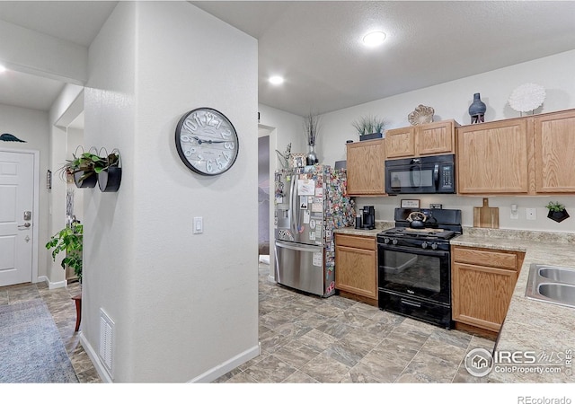 kitchen featuring black appliances and sink