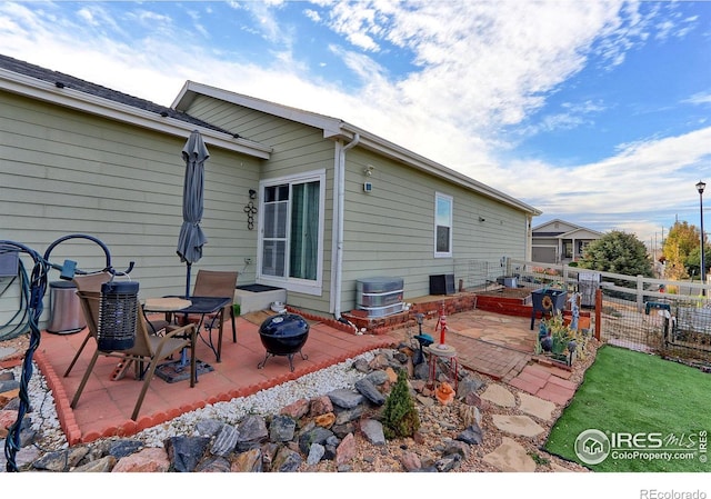 back of property featuring a patio area and central AC unit