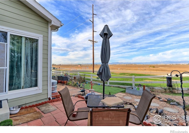 view of patio / terrace featuring a rural view