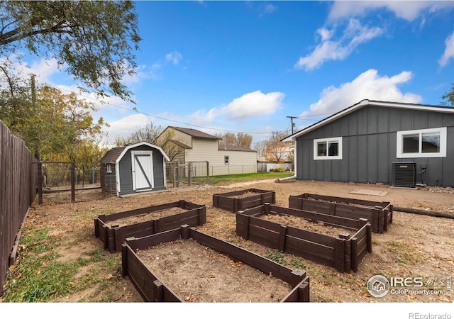 view of yard featuring a storage unit and central air condition unit