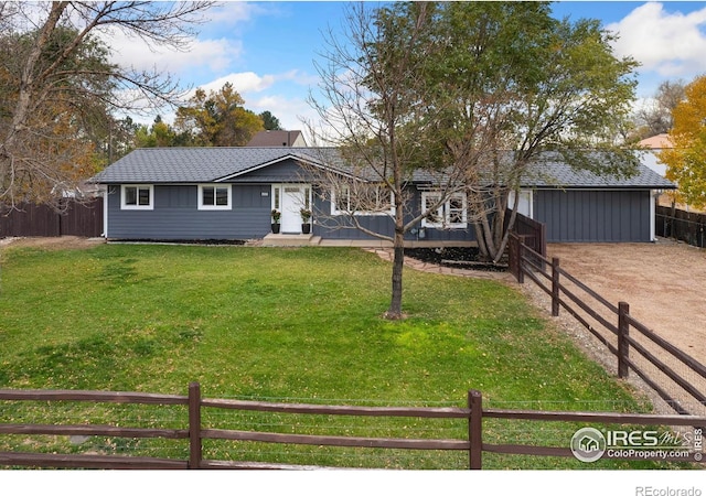 ranch-style home with a front lawn