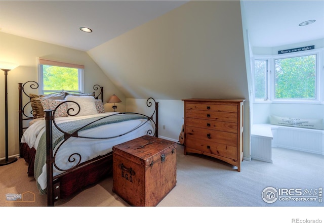 carpeted bedroom featuring vaulted ceiling