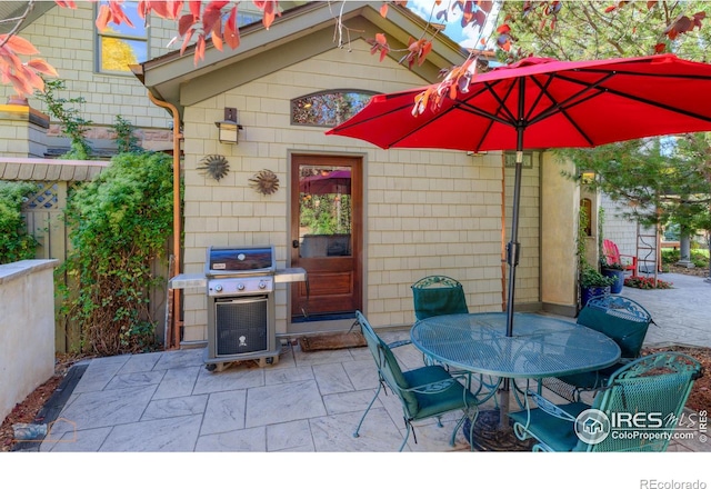 view of patio featuring a grill