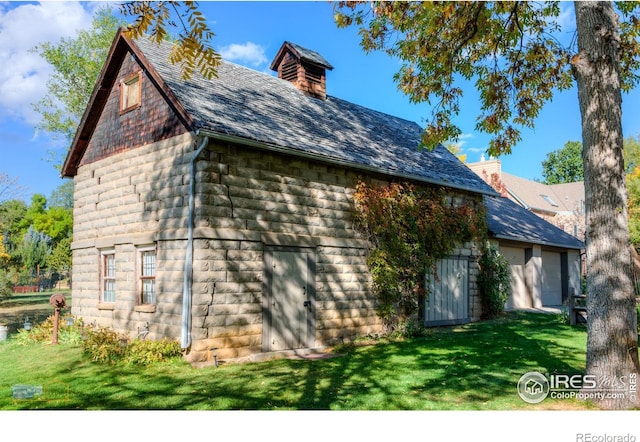 view of home's exterior featuring a lawn