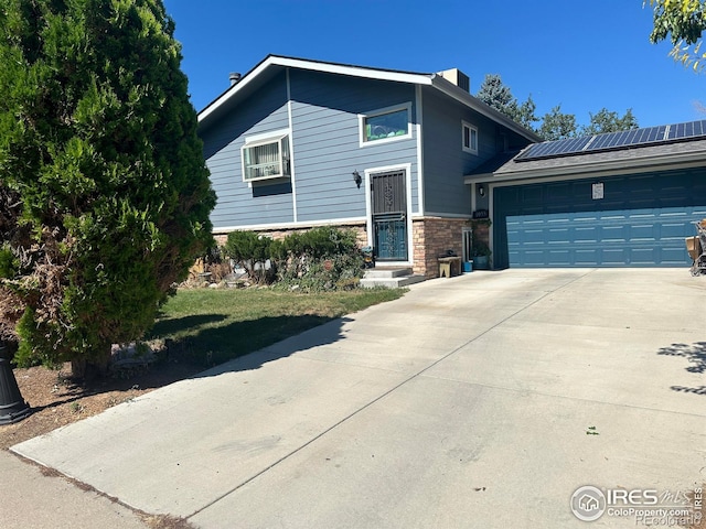 view of front of house with a front yard and a garage