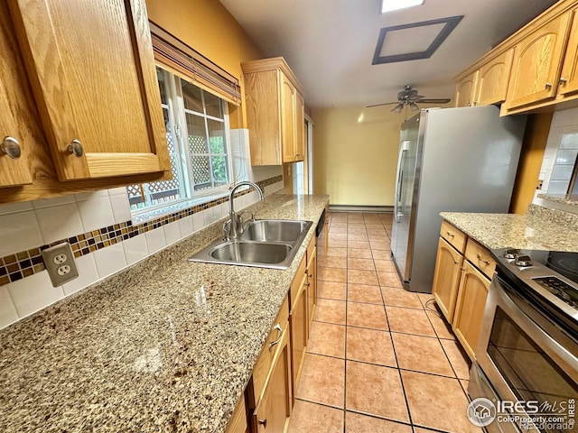 kitchen with light tile patterned flooring, sink, backsplash, ceiling fan, and stainless steel appliances