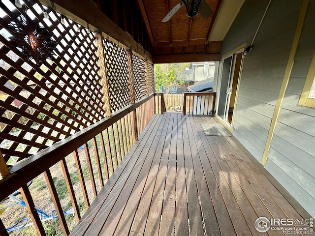 wooden terrace featuring ceiling fan