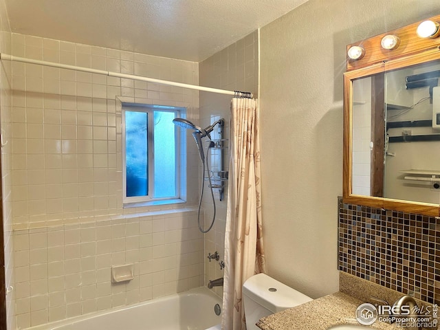 full bathroom featuring toilet, a textured ceiling, shower / bath combo, and vanity