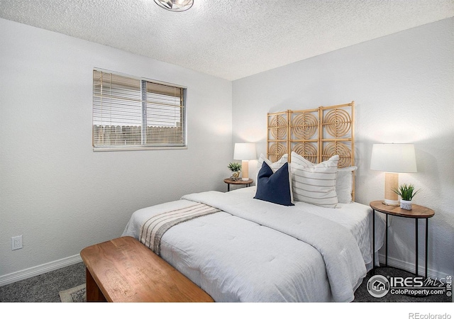 carpeted bedroom with a textured ceiling