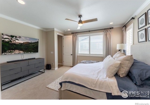 bedroom with ceiling fan, crown molding, and light colored carpet