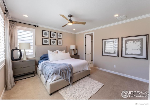 bedroom featuring light carpet, ornamental molding, and ceiling fan