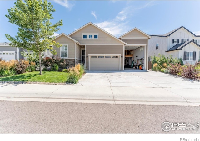 view of front of property featuring a garage and a front lawn