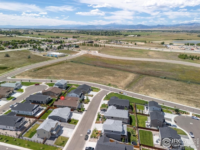 drone / aerial view featuring a mountain view