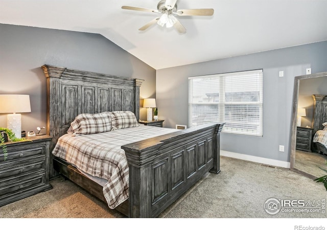 bedroom featuring carpet floors, vaulted ceiling, and ceiling fan