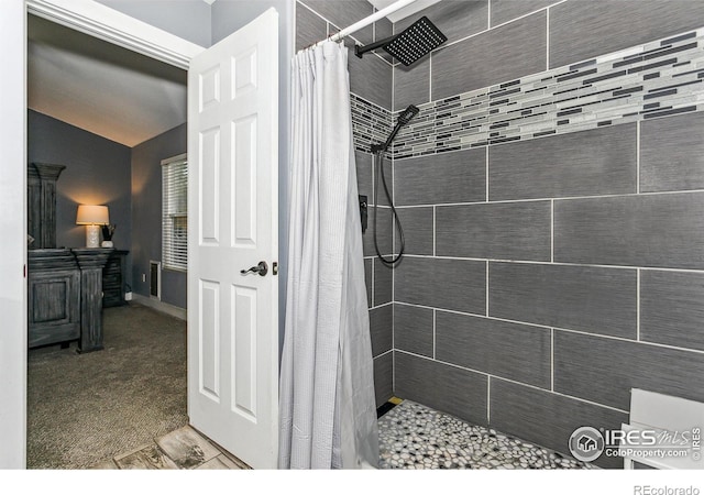 bathroom with a shower with shower curtain