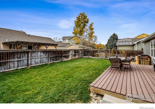 view of yard featuring a wooden deck